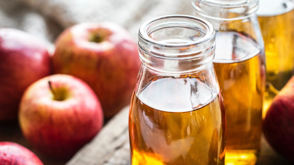 Jar of Apple Cider with Apples for Fall Wedding