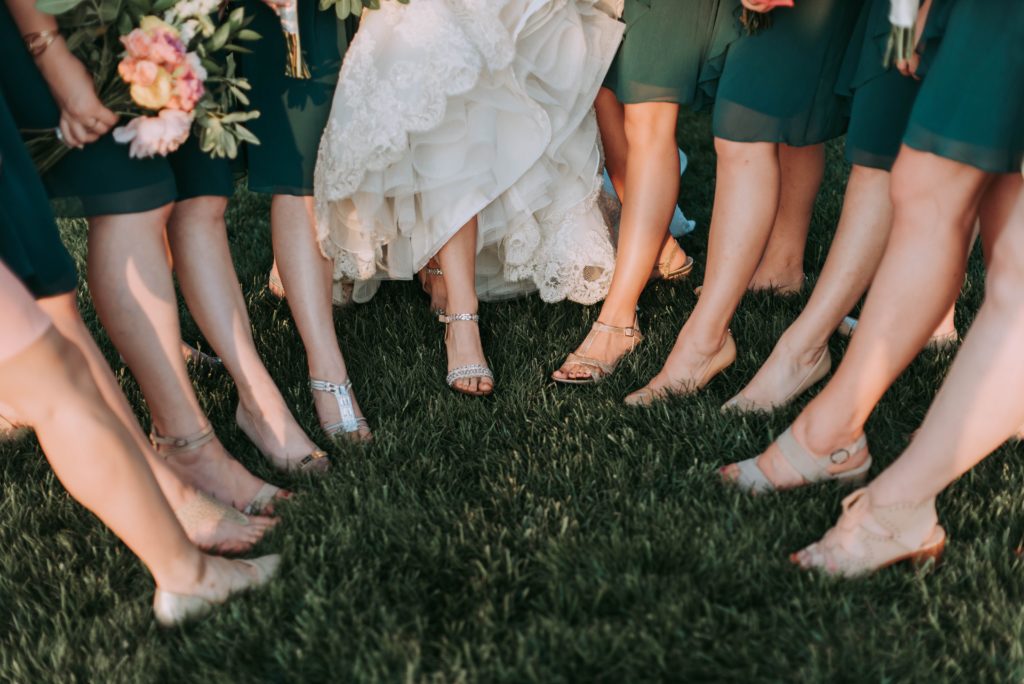 Bride and Bridesmaids showing off shoes